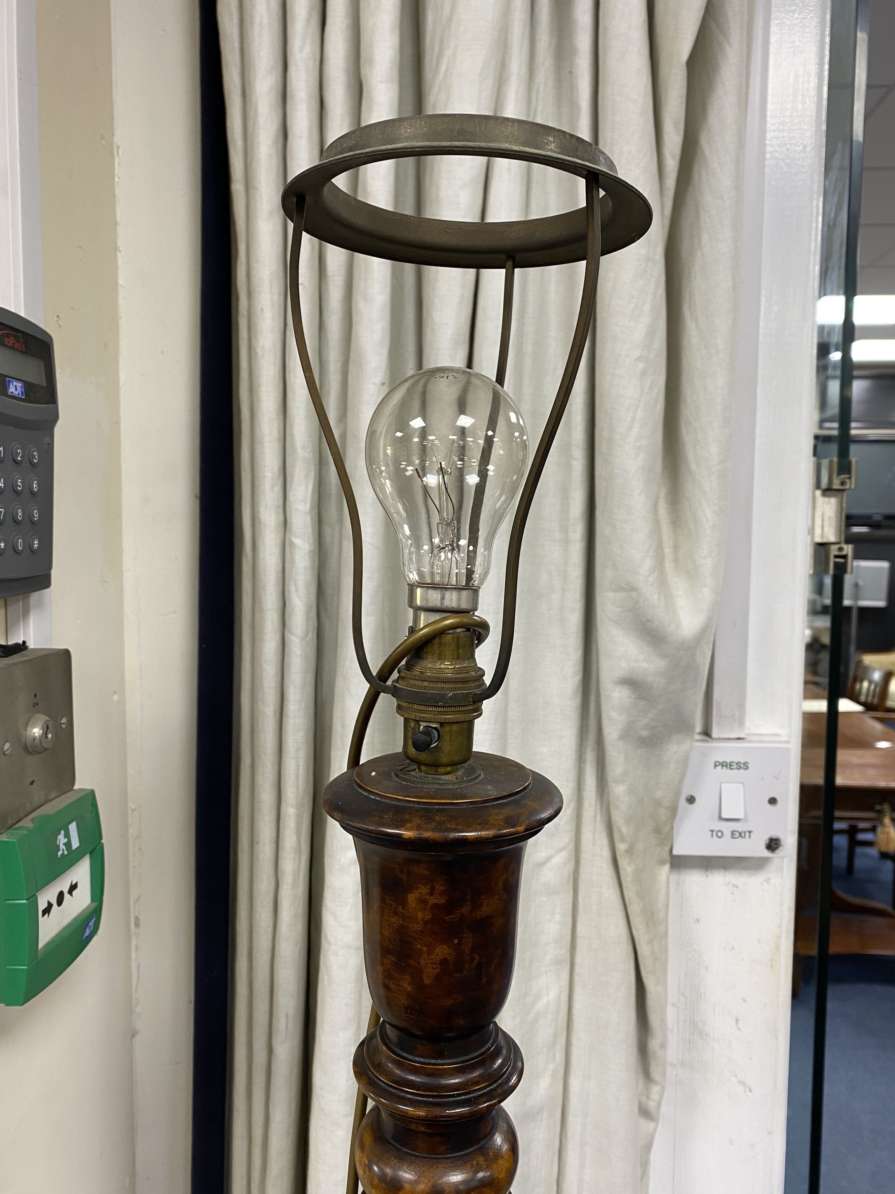 An early 20th century spiral turned walnut standard lamp, height 150cm